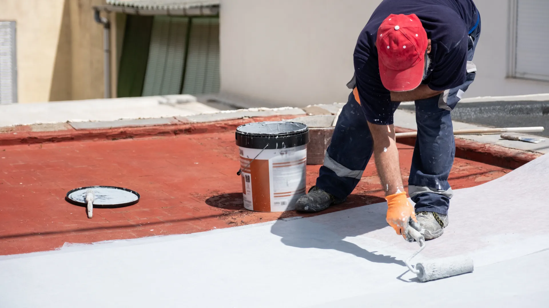 Roof painting and sealing in progress